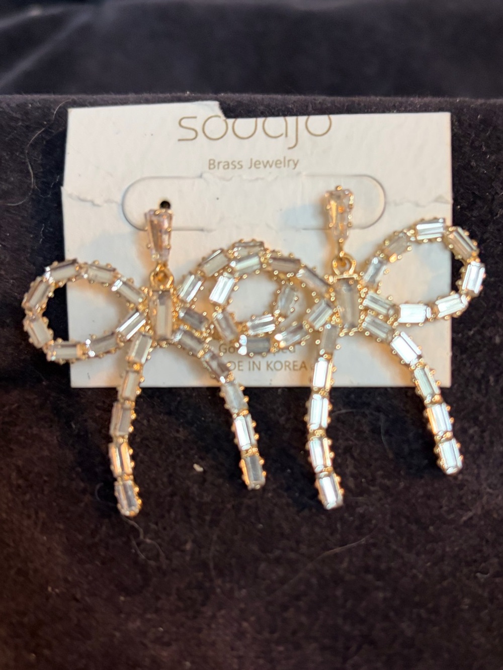 Gold Crystal Bow Drop Earrings with gold.